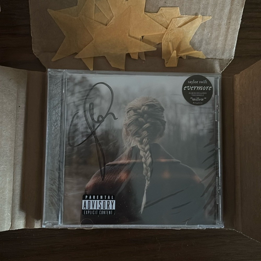 SOLD—- Signed Taylor Swift Evermore CD fully wrapped